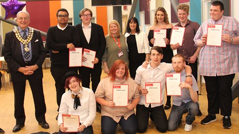Prince's Trust award winners standing in a line showing their certificates on complete of their course with the Mayor