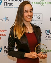 Student Award winner Anastasia posing with her glass award
