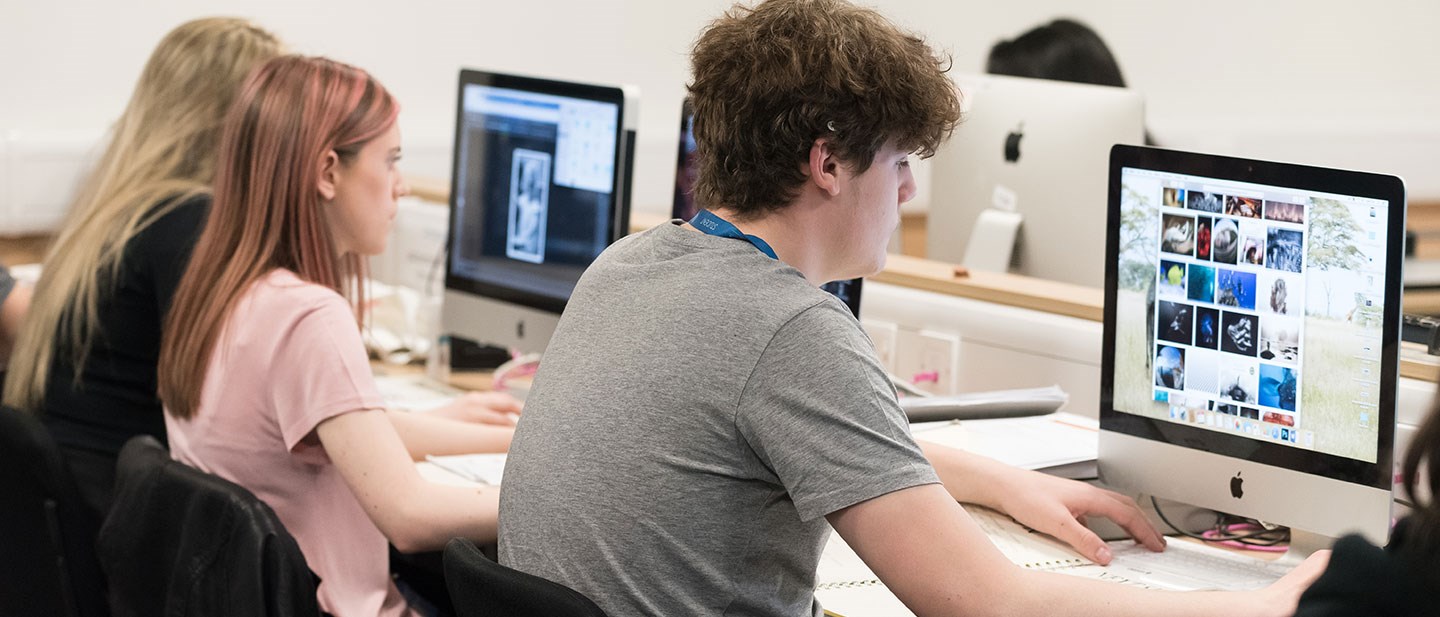 Visual Design student using apple Mac to complete coursework