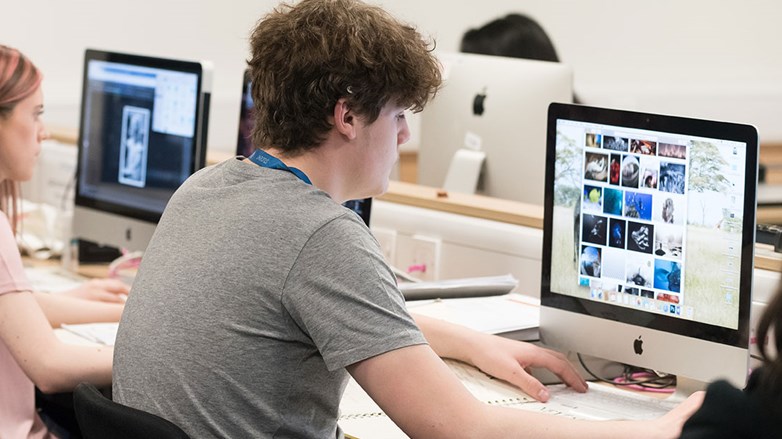 Visual Design student using apple Mac to complete coursework