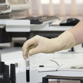 Person laboratory testing using test tubes