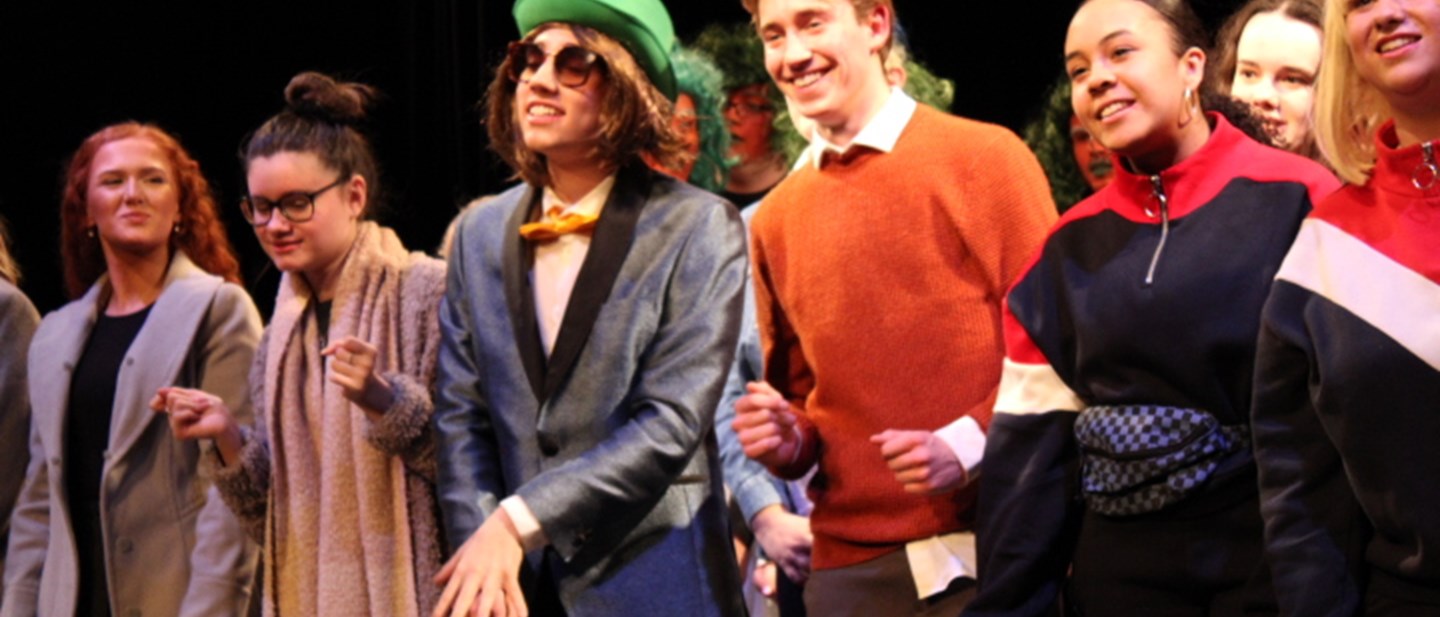 Students performing Willy Wonka in the Theatre