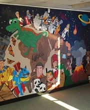 Art mural created by students which non-fictional characters including a dragon and an astronaut