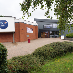 Seevic Campus exterior building and grass