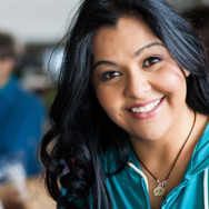 A female student with black hair smiling.