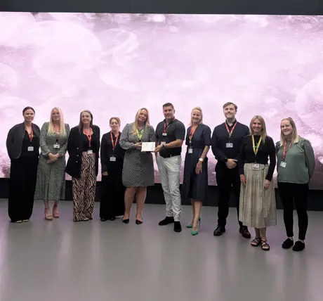 USP College staff celebrating their award win.