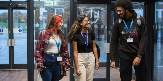 Students walking in Seevic Campus entry.