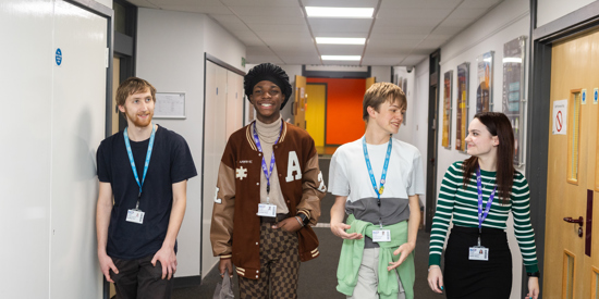 Students walking down a corridor.