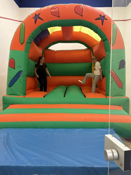 bouncy castle with 2 women on
